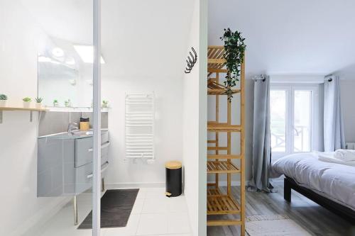 Ένα ή περισσότερα κρεβάτια σε δωμάτιο στο La Maisonnette 20 minutes de Disney