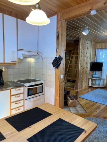 a kitchen with a stove and a counter top at Susitupa 5 in Salla