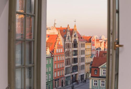 a view of a city from a window at Magiczne gniazdko na samym Rynku in Wrocław