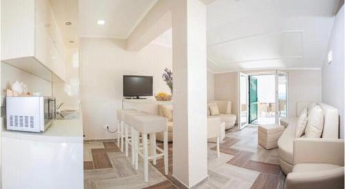 two images of a living room and a dining room at Villa Arar in Trogir