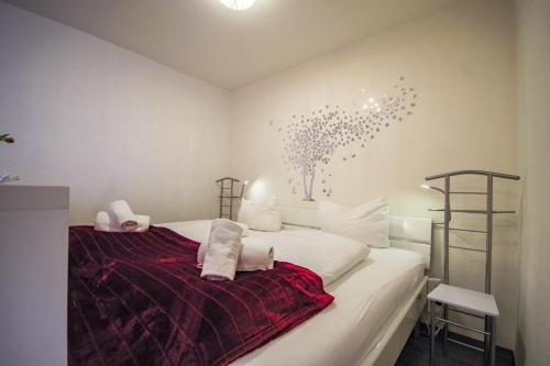 Postel nebo postele na pokoji v ubytování Apartmenthaus Frauenpreiss FeWo 111