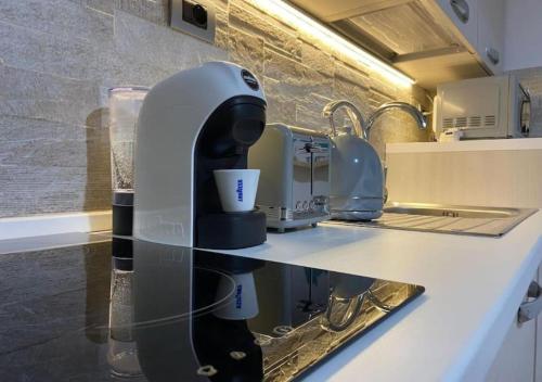 a coffee maker on a counter in a kitchen at [Loft Comodo ed Elegante] • Wi-Fi e Colazione in Sanluri