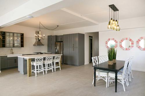 a kitchen and dining room with a table and chairs at N1 Condos in San Juan