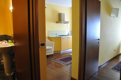 Kuchyň nebo kuchyňský kout v ubytování Piazza Nova Guest House
