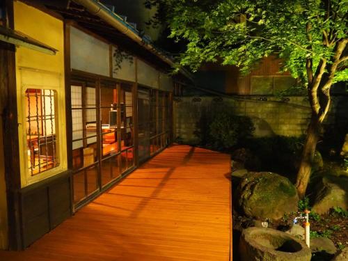 a wooden walkway in front of a building at fumoku - Vacation STAY 12988v in Chino