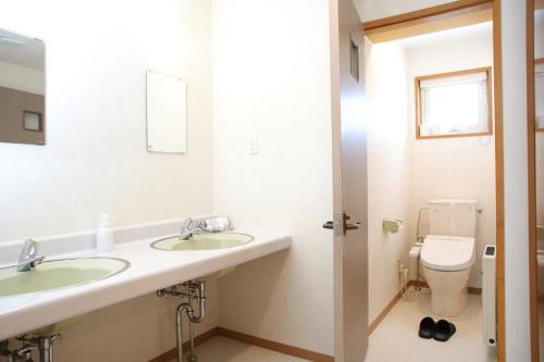 a bathroom with two sinks and a toilet at Esashi-gun - Cottage - Vacation STAY 38366v in Pinneshiri