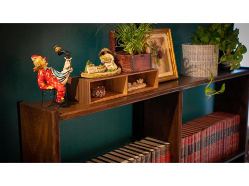 a shelf with some figurines on top of it at Innterhill Tsubasa Yufuin - Vacation STAY 94225v in Yufuin