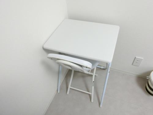 a white table and a chair in a room at Plage Yuigahama - Vacation STAY 00220v in Kamakura