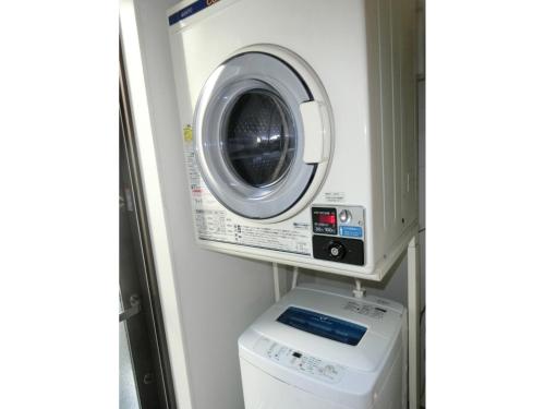 a washing machine and a washer in a room at Plage Yuigahama - Vacation STAY 00220v in Kamakura