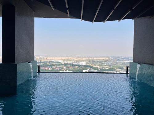 a view of a pool of water from a building at Luxury 1 bedroom apartment in Miraclz tower by Danube Properties in Dubai