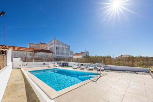 a swimming pool on the roof of a house at Sweet Home Sagres in Sagres
