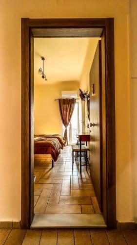 Ένα ή περισσότερα κρεβάτια σε δωμάτιο στο Central 9 Rooms