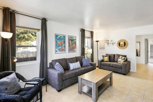 a living room with two couches and a table at 210 Forty Fourth Street in Newport Beach