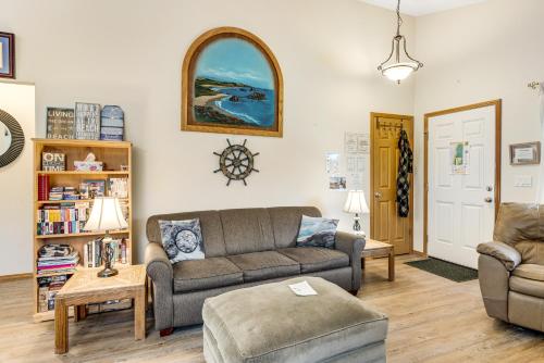 a living room with a couch and a chair at Cedar Creek Retreat in Rockaway Beach