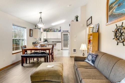 a living room with a couch and a table at Cedar Creek Retreat in Rockaway Beach