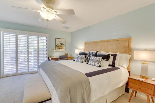 a bedroom with a large bed and a ceiling fan at Walk to Beach Hilton Head Island Resort Gem in Hilton Head Island