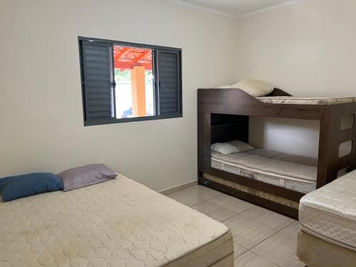 Postel nebo postele na pokoji v ubytování Chácara Toca do Oliveira