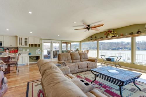 a living room with a couch and a table at Waterfront Lake of the Ozarks Home with Private Dock in Roach