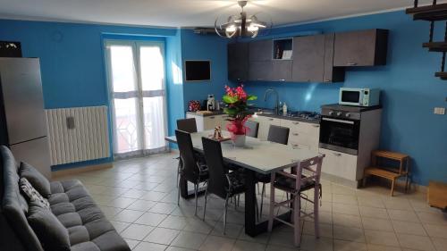 a kitchen and dining room with a table and chairs at LaFuntanella45 Casa Vacanze in Isernia