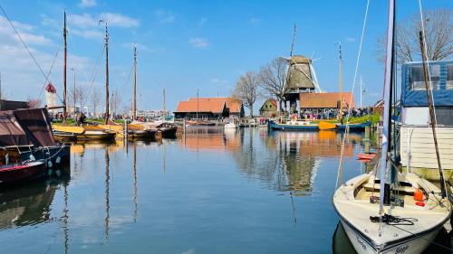 a group of boats are docked in a harbor at Woonboot 4 Harderwijk in Harderwijk