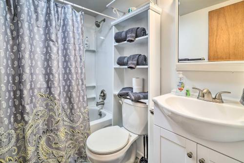 a bathroom with a toilet and a sink at Hot Tub and Resort Amenities Pocono Lake Retreat! in Pocono Lake