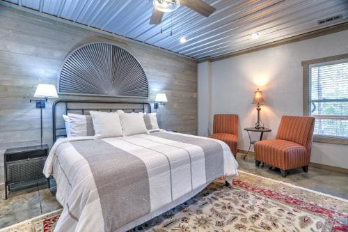 a bedroom with a large bed and two chairs at Napa Blue Ridge Cabin in Blue Ridge