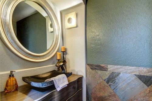 a bathroom with a sink and a mirror at Arizona Vacation Rental with Private Pool and Pergola! in Phoenix