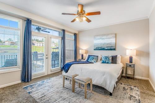 a bedroom with a bed and a ceiling fan at Grand Getaway in Hot Springs