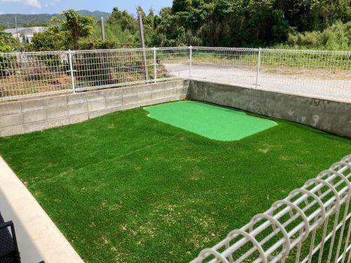 a small artificial grassificialificialificialificialificialificialificialificialificialificialificialificial at New Normal Hotel in NAGO ニューノーマルホテルイン名護 in Nago