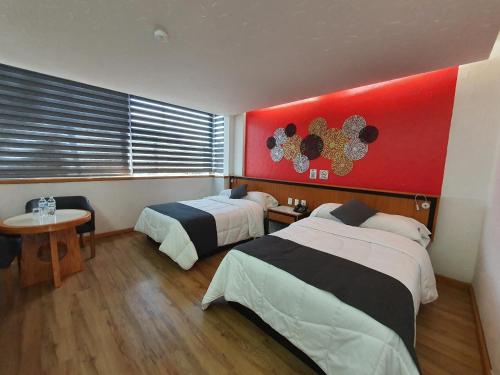 Postel nebo postele na pokoji v ubytování Hotel Alcampo