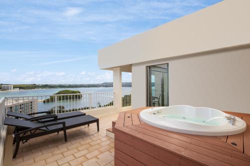 a bath tub on the deck of a house at RIHGA Royal Laguna Guam Resort in Tamuning