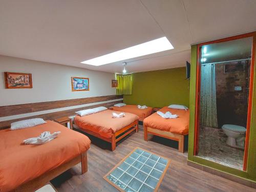 Postel nebo postele na pokoji v ubytování Ukukus Hostel