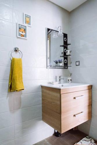 a bathroom with a sink and a mirror at Cozy New Studio in Mohammedia in Mohammedia