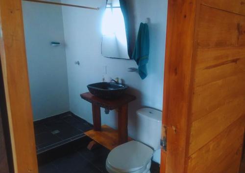 a bathroom with a sink and a toilet at Cozy cabin Casa Enya in Sibundoy