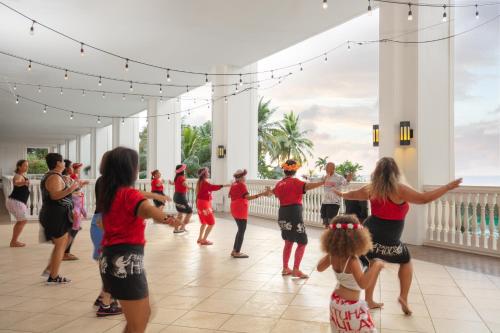 a group of people dancing on a dance floor at RIHGA Royal Laguna Guam Resort in Tamuning