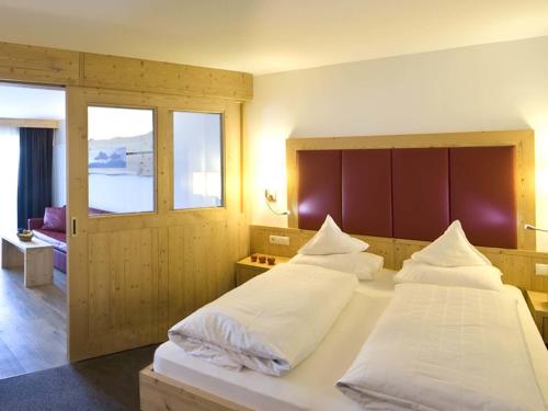 Ένα ή περισσότερα κρεβάτια σε δωμάτιο στο Martina Breakfast Lodge