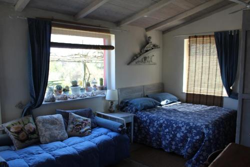 Tempat tidur dalam kamar di Lo Chalet sul Golfo