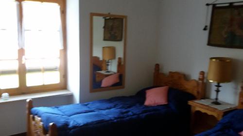 Postel nebo postele na pokoji v ubytování Cascina Torello