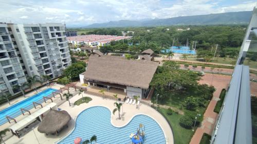 an aerial view of a swimming pool in a resort at Acogedor Apartamento en Ricaurte con BBQ in Girardot