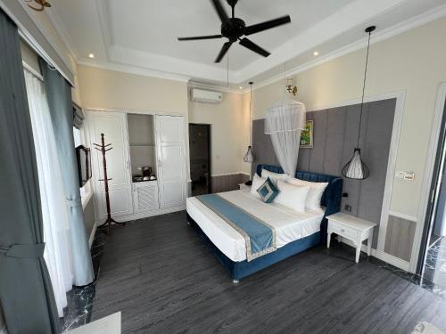Ένα ή περισσότερα κρεβάτια σε δωμάτιο στο Vườn Vua Resort & Villas