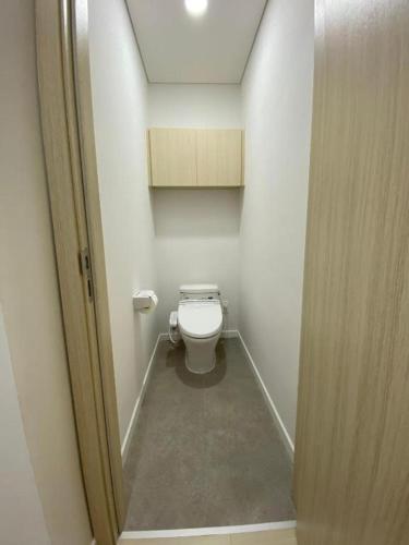 a bathroom with a toilet in a small room at FAMILLE HA NAM in Lưu Xá