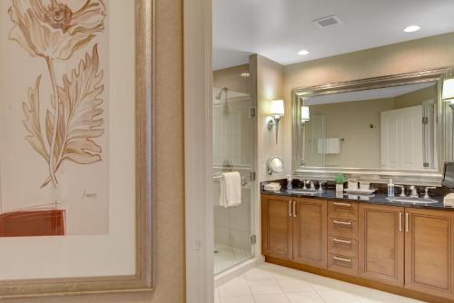 a bathroom with a large mirror and a sink at Stunning Balcony Strip View MGM Signature * Free Valet in Las Vegas
