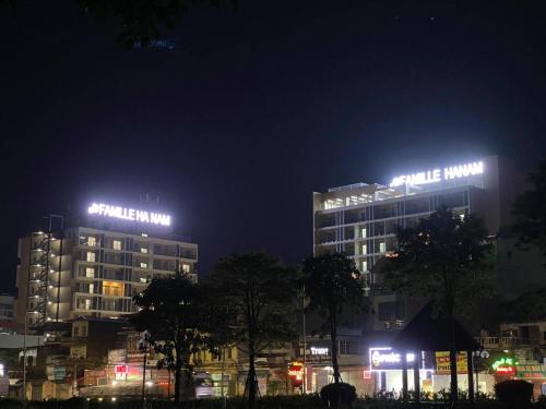 a building with lights on top of it at night at FAMILLE HA NAM in Lưu Xá