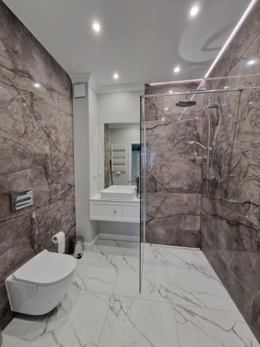 Ванна кімната в Apartament Baltic Lux Sztutowo