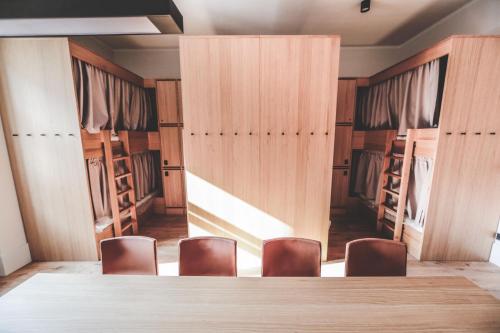 a conference room with a table and chairs in it at Ruttner Ház in Veszprém