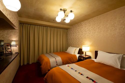 Ένα ή περισσότερα κρεβάτια σε δωμάτιο στο Kinugawa Grand Hotel Yumenotoki