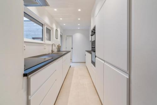 Kuchyň nebo kuchyňský kout v ubytování Maison les Bruyères 1 - Luxueus wonen Blankenberge
