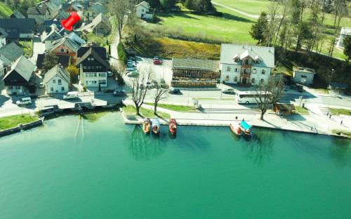 an aerial view of a lake with boats in the water at Lakeside Apartments Bled in Bled