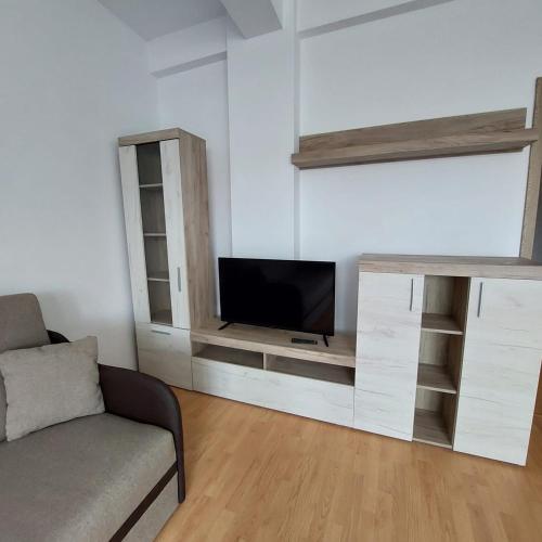 Televizorius ir (arba) pramogų centras apgyvendinimo įstaigoje Rio Apartament