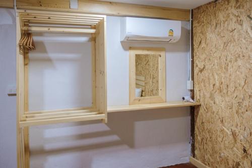 a room with a closet with a mirror and a staircase at Lipe Garden Beach Resort in Ko Lipe